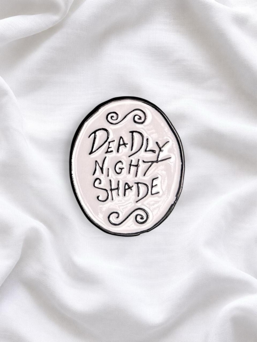 Deadly Nightshade Oval enamel pin  - black on White